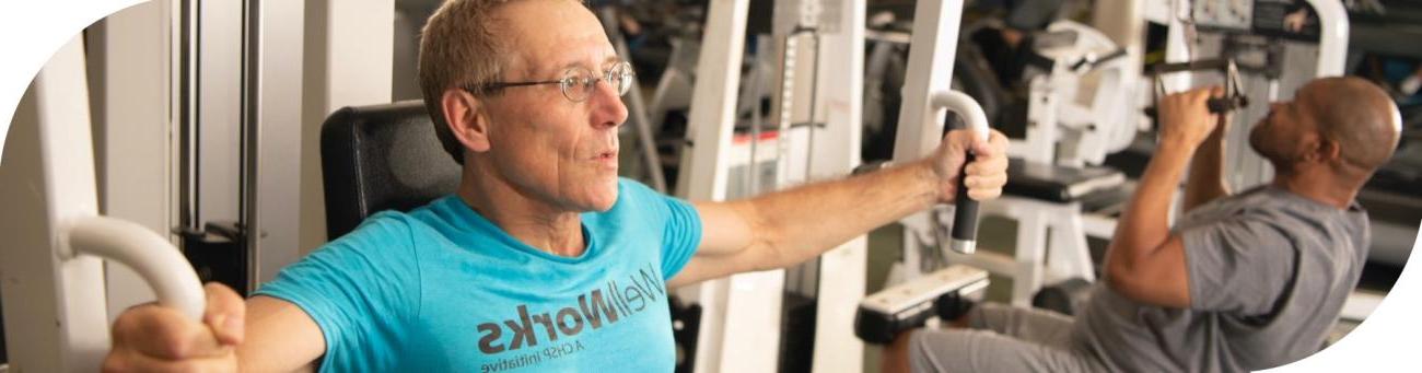 WellWorks members on strength equipment