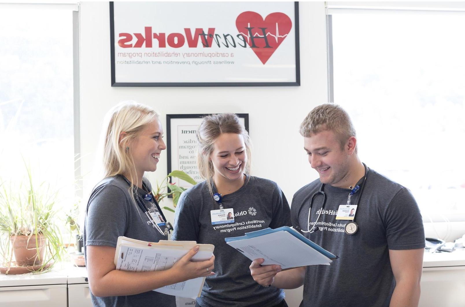Exercise Physiology Graduate Students in front of HeartWorks sign