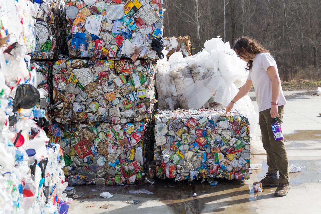 Recycling employee observing a bale of aluminum cans at the AHRC site